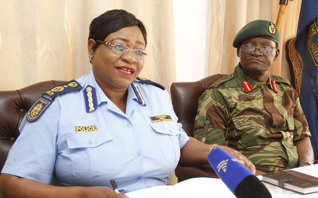 Zimbabwe Defence Forces Spokesperson Colonel Overson Mugwisi (right) with Zimbabwe Republic Police national spokesperson Senior Assistant Commissioner Charity Charamba (left) during a press conference on Police and Army personnel clashes in town. (Picture by John Manzongo)