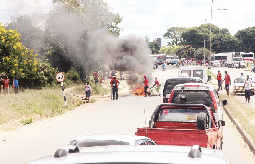 Rowdy MDC-T supporters barricade the road with burning tyres ahead of Advocate Nelson Chamisa’s rally at White City Stadium yesterday.