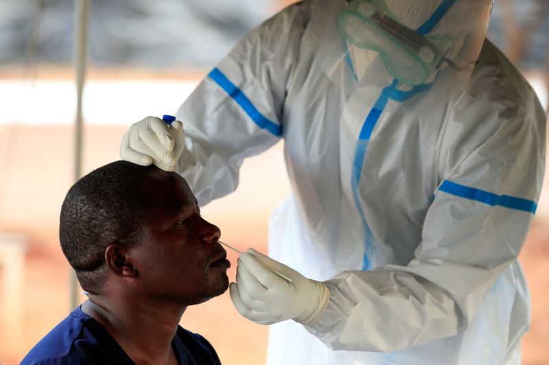 Pandemic ... A man is tested by a healthcare worker during a nationwide lockdown to help curb the spread of the coronavirus disease (COVID-19), at a mass screening centre in Harare, April 30, 2020 (REUTERS/Philimon Bulawayo)